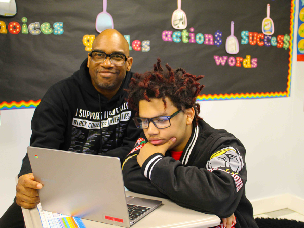Teacher smiling with student